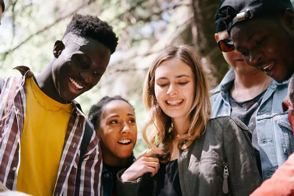 group of teens smiling together
